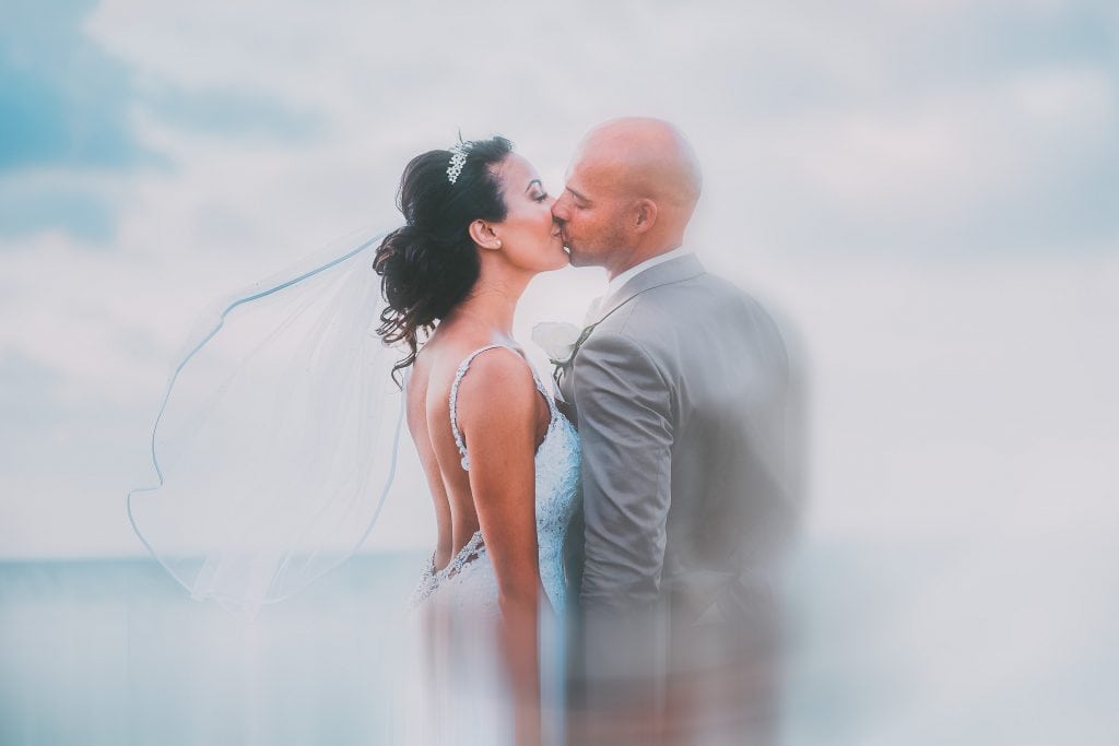 Bride and Groom kissing on a Jamaican Beach Wedding