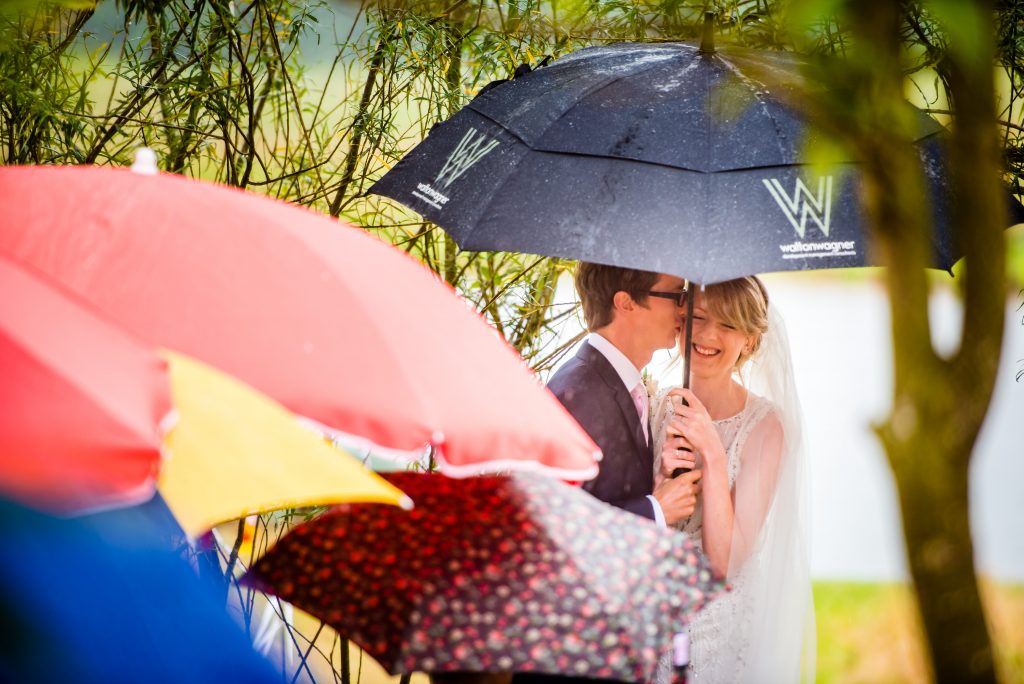 Bride and Groom saying there wedding vows on a rainy day at their alternative wedding
